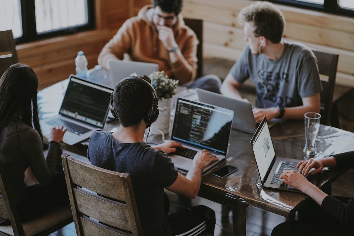 Delivery team collaborating around a conference table